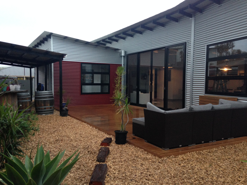 A ground level north facing desk adjacent to the living room sliding doors.